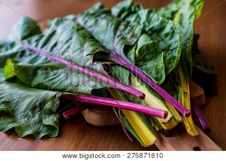 Raw Organic Rainbow Swiss Chard On Wooden Surface. Organic Food.