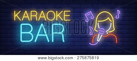 Karaoke Bar Neon Text And Singer With Microphone. Karaoke Bar Advertisement Design. Night Bright Neo