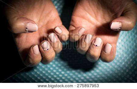 Womans Hands Showing Semipermanent Beige Manicure. Beauty Nails