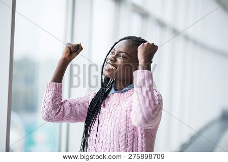Portrait Afro American Woman With Reised Hands Up Celebrate Success And Goods Results On Pamoramic W