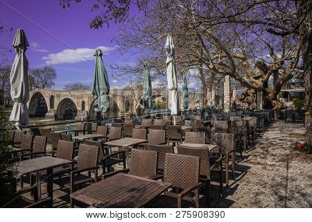 Landscape With Giant Tree Near Medieval Bridge Over River Arahthos In Arta, Greece