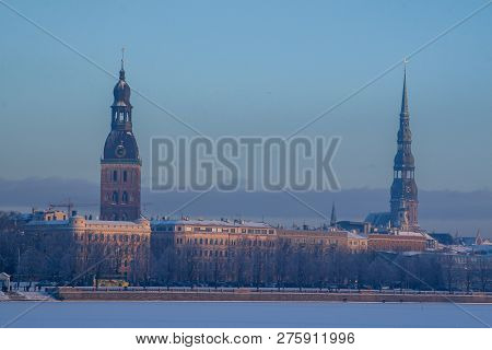 Riga View In Winter. Riga, Capital City Of Latvia In Winter Time. View Of Church And Cathedral. View