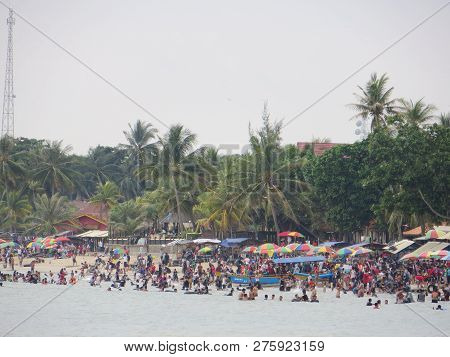 Anyer, Indonesia - June 24, 2018: Crowd Of People Doing Activities At Sambolo Beach. Month Of June I