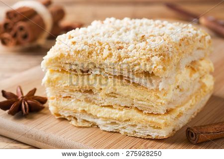 Layered Cake With Cream Napoleon Millefeuille Vanilla Slice With Cinnamon And Anise On Wooden Backgr