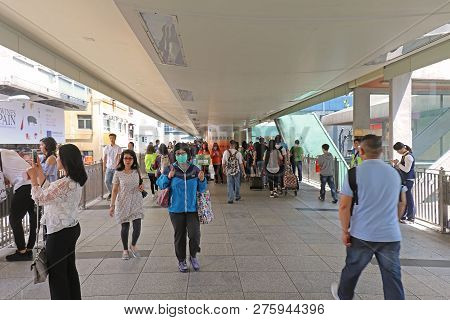 Hong Kong, China - April 29, 2017: Asian People With One Woman Wearing Surgical Mask For Virus Prote