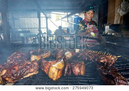 Kundasang Sabah, Malaysia -oct 27, 2017: Vendor Preparing A Barbecue Wild Boar, Famous Street Food I