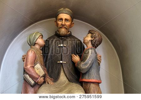 LUSON, ITALY - JULY 14, 2018: Josef Freinademetz missionary in China sculpted by Leonhard Delago of Bula in the Saint George church in Luson, Italy