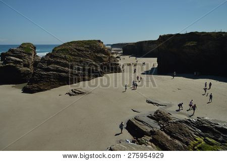 Geological Formations With Hundreds Of Visitors On The Beach Of The Cathedrals In Ribadeo. August 1,