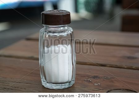 A Glass Salt Shaker At The Wooden Table, Oudor Scene