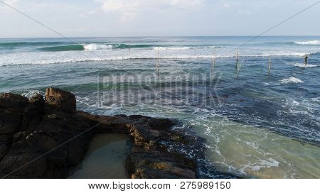 The Stilt Fishing Is One Of The Most Popular Tourist Attraction On Sri Lankan Coast, People Come To 