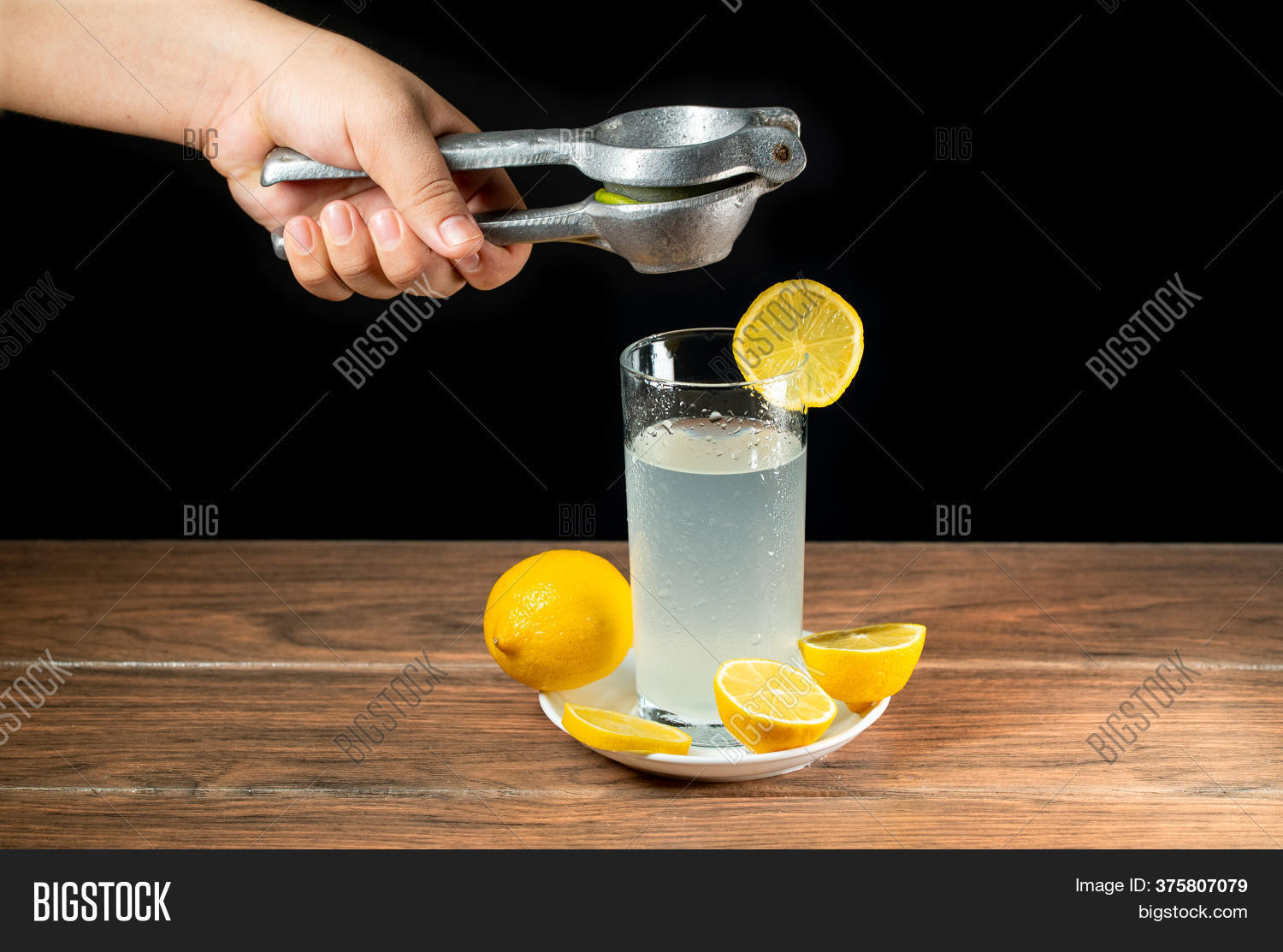 Squeezing Lemon Into Image & Photo (Free Trial) Bigstock