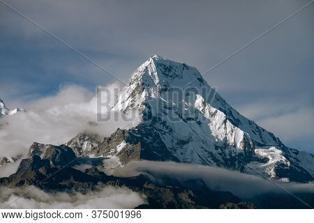 Annapurna South Massif South Face As Seen From Mohare Danda In Nepal During Golden Hour. Tight Shot 