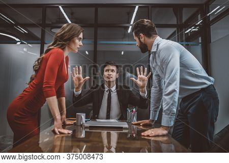 Lawyer Trying To Stop The Argument Between Spouses