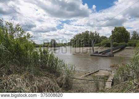 Tielrode, Belgium, Jetty For The Ferry That Puts Cyclists And Pedestrians Across The River Durme