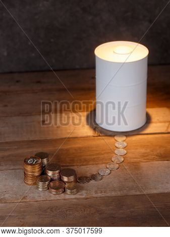 Investing In Oil. Barrel Of Oil And Coins