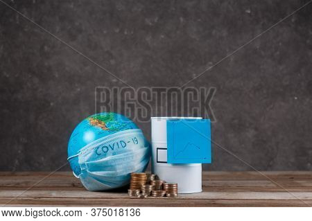 Financial Crisis Of Oil On The Planet Associated With The Epidemic. Globe With A Bandage And A Barre