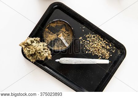 The Pot Leaves On Buds Cbd. White Background. Sativa Indica Medical Health. Thc Kief In Grinder.