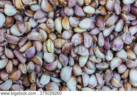 Garlic Pile For Sale In Market On Full Flame Photo Background, Garlic Vegetable Concept, Healthy Org