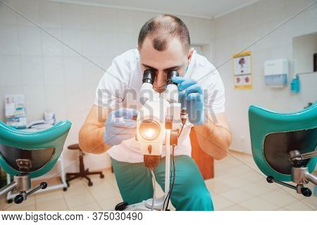 Gynecologist Working With Colposcope In Clinic. Medical