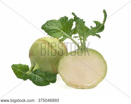 Fresh Kohlrabi With Green Leaves And Its Half Isolated On A White Backround