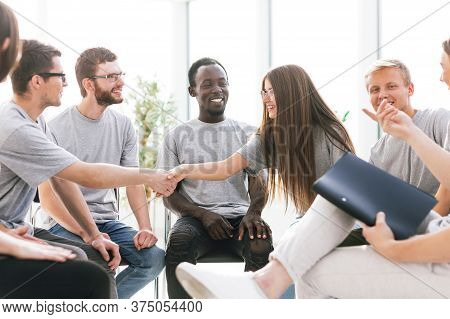 Young People Shaking Hands During The Colloquium