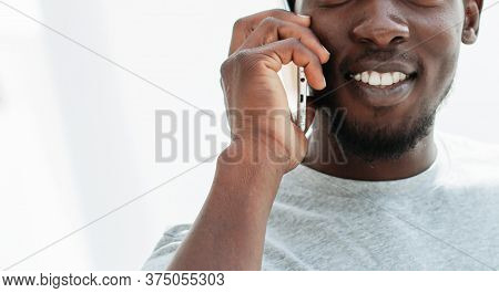 Side View. Stylish Young Man Talking On His Smartphone.