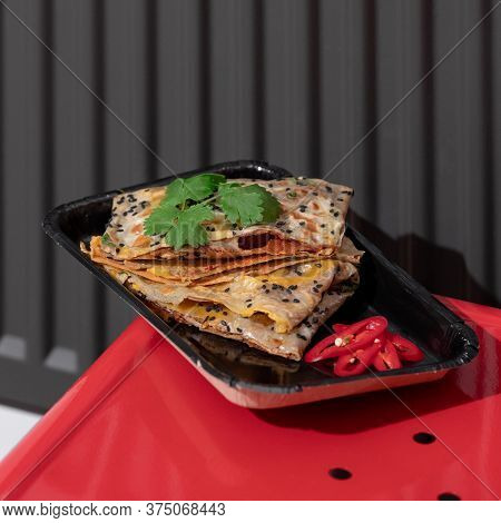 Top View Of Fried Chinese Pancake Or Fried Steamed Dumpling Made Of Garlic Chives, Rice Flour And Ta