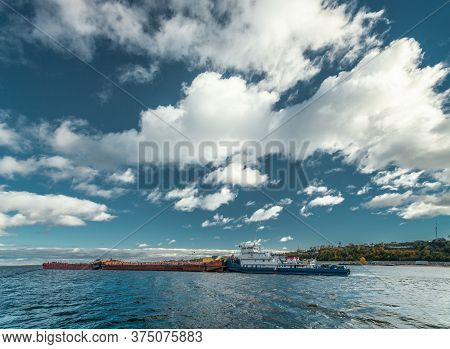 Kozmodemiansk, Mari El, Russia - 2012 October, 02: The Tow Pushes The Barge At The Volga River