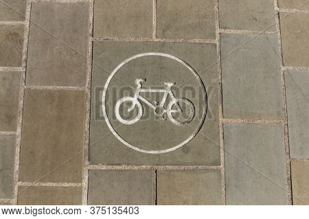 A Close Up View Of A Bicycle Only Sign That Has Been Painted On The Pavement