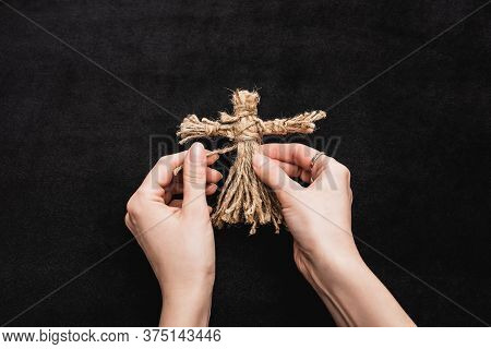 Cropped View Of Woman Holding Voodoo Doll On Black
