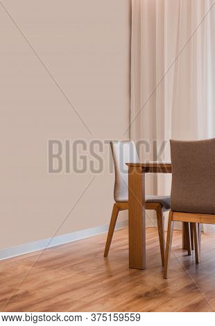 Stylish Kitchen Interior With Dining Table And Chairs