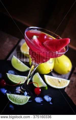 Alcoholic Cocktail With Watermelon, Lemon, Lime, Tequila And Ice, Black Background, Selective Focus