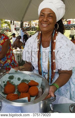 Salvador, Bahia / Brazil - May 1, 2013: The Baiana De Acareje Teresa Conceicao, Is Seen Preparing Fo