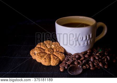 Cup Of Hot Coffee With Cookies And Coffee Beans