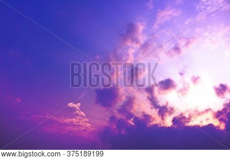 The Explosion Of Light In Purple Sky With Blurry Clouds