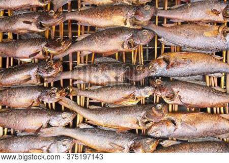 Smoked Fish. Smoke. Hot Smoked Fish Meat. Smoked Fish. Perch. Smoked Fish Background Texture.