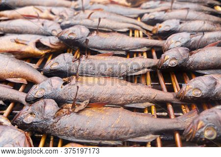 Smoked Fish. Smoke. Hot Smoked Fish Meat. Smoked Fish. Perch. Smoked Fish Background Texture.