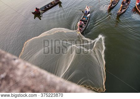 Mandalay, Myanmar - Nov 12, 2019: Fishermen Near U Bein Bridge In Amarapura,mandalay Myanmar
