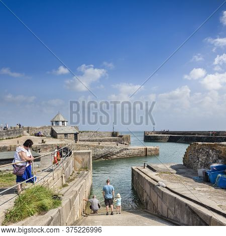 11 June 2018: Charlestown, Cornwall, Uk - Tourists At Charlestown, An Unspoiled Example Of A Georgia