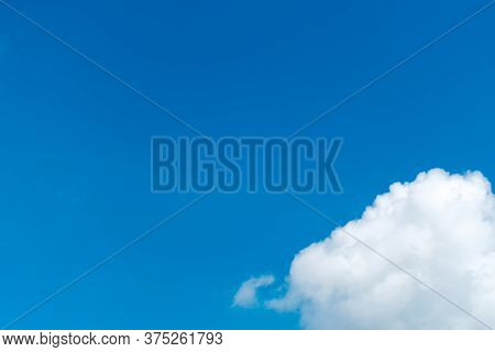 White Cloud With Copy Spacce Against The Clean Blue Sky.