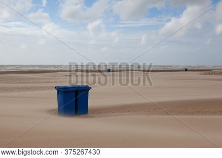 Sand Covered Trash Can On The Empty Beach. The Beach In Hargen Aan Zee In Netherlands Without Foreig