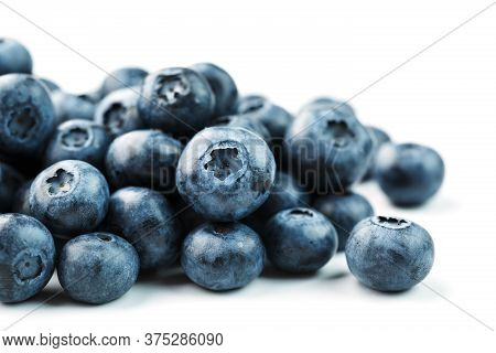 Tasty Blueberries Fruit Are Scattered On A White Background.