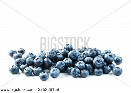 Tasty Blueberries Fruit Are Scattered On A White Background.