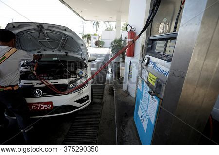 Salvador, Bahia / Brazil - November 22, 2018: Vehicle During Filling With Vehicular Natural Gas - Cn