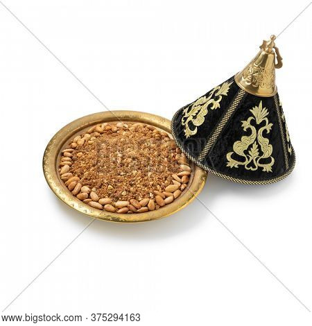 Traditional Moroccan homemade sellou on a metal tajine isolated on white background