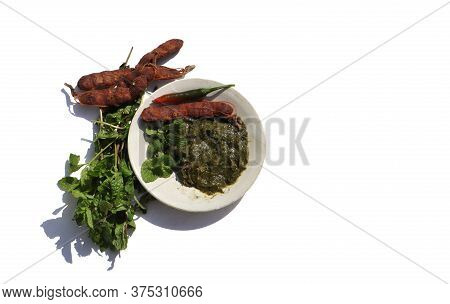 Pudina Chutney Or Field Mint Leaves Paste In A Plate With Raw Ingredients Isolated On White Backgrou