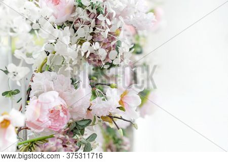 Flower Wall, Wedding Backdrop, Floral Hand Made Decoration. Light Background Of Artifical Flowers. V