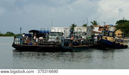 Santa Cruz Cabralia, Bahia / Brazil - December 6, 2010: Ferry Is Seen As It Crosses Vehicles And Peo