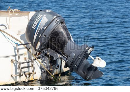 Primelin - France, October 04, 2018 : Yamaha Motor Of A Boat Turned-up In Primelin Harbor
