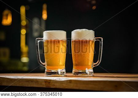 mug full of chopp, with chopp pilsen on a rustic table